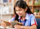 Student enjoying a book in the library